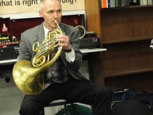 Mein Nachbar (neighbor) warms up. His son played a solo on trombone in the concert.