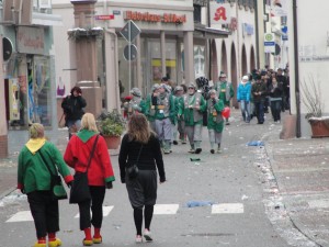 Costumed people walking toward downtown Kandern