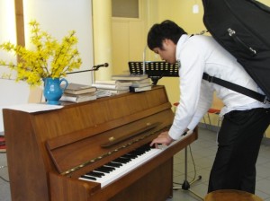 cellist playing piano